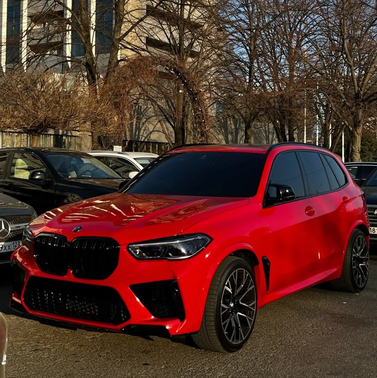 A picture of a BMW X1 that is red in colour